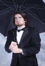 Man Holding Umbrella in the Rain and Sighing Royalty Free Stock Photo