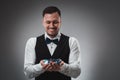 A man holding up poker chips. Poker Royalty Free Stock Photo