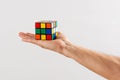 Man holding up an unsolved Rubiks Cube Royalty Free Stock Photo