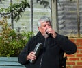 Man holding a vacuum flask and drinking..