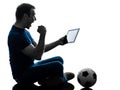 Man holding watching digital tablet silhouette Royalty Free Stock Photo