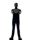 Man holding watching digital tablet silhouette Royalty Free Stock Photo