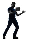 Man holding watching digital tablet silhouette Royalty Free Stock Photo
