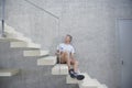 Man Holding Water Bottle On Steps Royalty Free Stock Photo