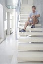 Man Holding Water Bottle On Steps Royalty Free Stock Photo