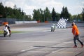 Man holding and waving the checkered flag at the finish of the race Royalty Free Stock Photo