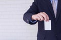 Man holding white business card on concrete Royalty Free Stock Photo