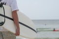 Man holding a white Surfboard Royalty Free Stock Photo
