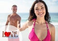 Man holding woman hand on beach Royalty Free Stock Photo