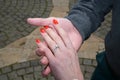 Man holding woman`s hand with engagement diamond ring Royalty Free Stock Photo