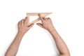 Man holding a wooden set square