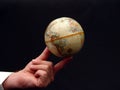 Man Holding World Globe in Color