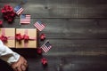 Man Holding Wrapped Gift Box With Stars - Unveiling a Special Surprise Present, Top view of labor day letters alphabet wooden Royalty Free Stock Photo