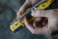 A man is holding a yellow and black box of screwdriver bits Royalty Free Stock Photo