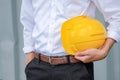 Man holding yellow helmet Royalty Free Stock Photo