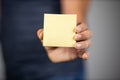 Man holding a yellow sticky note Royalty Free Stock Photo