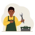 A man holds an adjustable wrench in his hand and a tool box next to it. The concept of technical repair or service. Royalty Free Stock Photo
