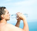 Man holds in both hands plastic bottle