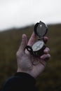 Man holds a compass in his hand. man wathing compass holding in his hands