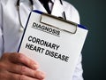Man holds Coronary heart disease CHD or artery disease CAD.
