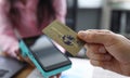 Man holds credit card with PayPass technology