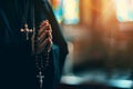 A man holds a cross in his hands and prays intently in a Christian church, AI generation Royalty Free Stock Photo