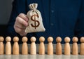 A man holds a dollar money bag above the crowd. Royalty Free Stock Photo