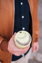 A man holds an eco mug in his hands. ecology concept. environmental concern. Royalty Free Stock Photo