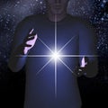 Man holds energy between hands Royalty Free Stock Photo