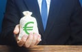 Man holds euro money bag. Granting financing business project or education. Provision cash financial credit. Profits dividends.