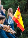 A man holds a flag of Spain