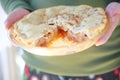 Man holds a freshly-baked apple pie