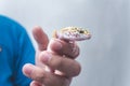 A man holds a friendly juvenile leopard gecko in his hand. A reptile lover, pet owner or herpetologist Royalty Free Stock Photo