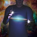 Man holds galaxy between his hands