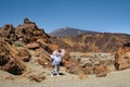 A man holds a girl in the crater of the Teide volcano.Tenerife, Canary Islands