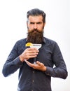 Man holds glass, delicious cocktail with orange, margarita.