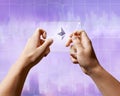 A man holds a glass screen with Icons of ethereum and a crypto currency graph Royalty Free Stock Photo