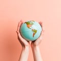 A man holds a globe in his hands - AI generated image Royalty Free Stock Photo