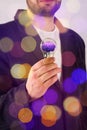 Man in suit holding light bulb with model of human brain. Electric power and new technology concept.