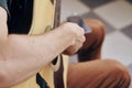 Man holds a guitar, musical instruments, music, notes, strings