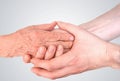 Man holds hands of eldery woman. Senior help and assistance concept. Royalty Free Stock Photo