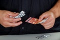 Man holds in his hands the drugs and money social problems expensive medicine