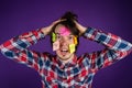 A man holds his hands on his head, stickers on his face. A man is shocked by his obligations and routine. Stickers with Royalty Free Stock Photo