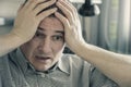 The man holds his head in his hands. . Problems in personal life and at work. Stress. Migraine is a consequence of stress Royalty Free Stock Photo