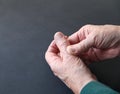 Older man with thumb pain closeup