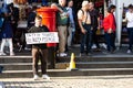 A Man holds a sign offering to buy tickets for the Military Tattoo in Edinburgh during The Fringe Festival 2018 Royalty Free Stock Photo