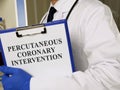 Man holds inscription Percutaneous coronary intervention pci in the hospital