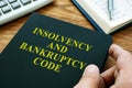 Man holds Insolvency and bankruptcy code IBC Royalty Free Stock Photo