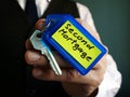 Man holds key with Second Mortgage sign