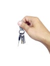 The man holds the keys in hand on a white isolated background Royalty Free Stock Photo